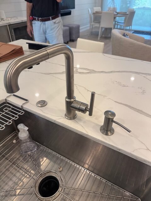Kitchen faucet and fixture work shown on the A Plus Plumbing website